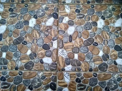 Floor with pebbles pattern background. Stone textured surface Stock Photos