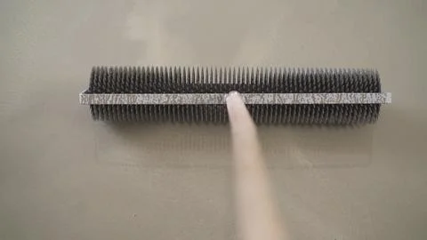 Floor pouring process. A worker in macro steps applies the solution to the fl Stock Photos