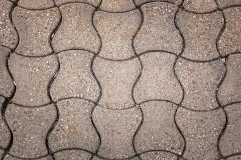 Floor in self-blocking cobblestones. Background, texture, flat lay Stock Photos