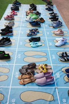 Floor sheet with allocation block numbers for putting shoes orderly. Stock Photos