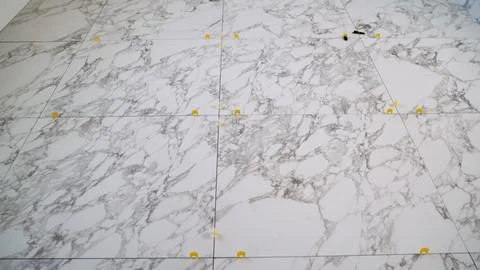 Floor Tiling Process with Marble Tiles Stock Photos