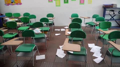 Floor view motion to the right showing empty school classroom with chairs und Stock Footage 256719868