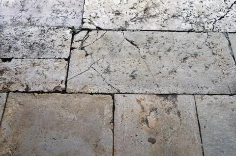 The floor of the yard is laid out with rectangular pieces of stone Stock Photos