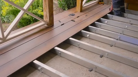 Flooring installation work builder construction terrace. Renovation house. Deck Stock Footage 155701842