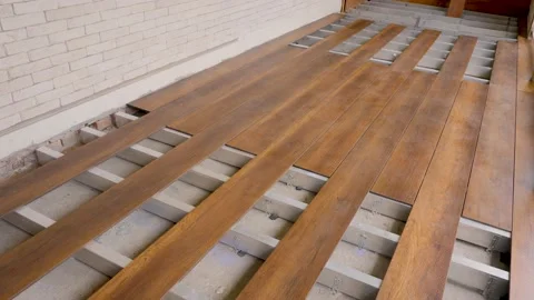 Flooring installation work construction home renovation building wood deck plank Stock Footage 155821885