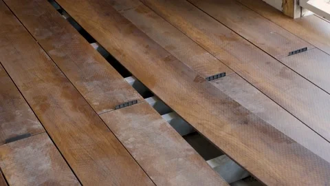 Flooring installation work construction home renovation building wood deck plank Stock Footage 155821918
