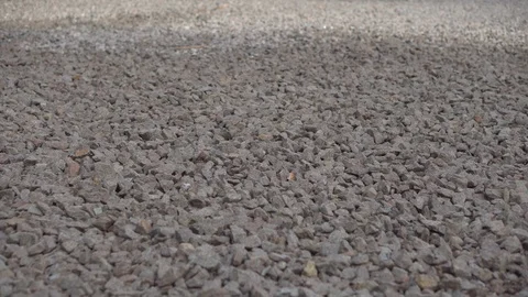 Flooring of rubble for laying the road. Construction work on the city street. Video stock 92729689