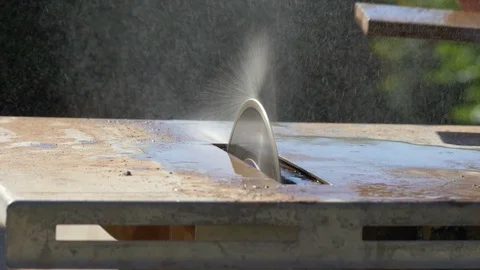 A flooring worker sawing tile on a wet saw Stock Footage 108006269