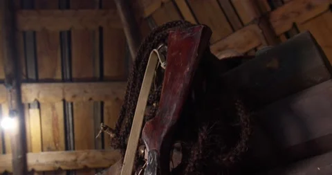 Floors of sections of tree stumps. Forged grille on window. Hunting accessories. 스톡 동영상 132582949