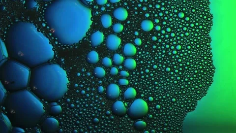 Floping multicolored bubbles. Top view. Close up. Vídeos de archivo 165170481