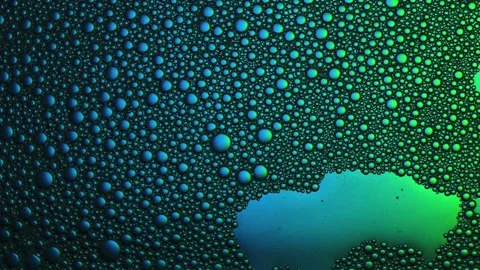 Floping multicolored bubbles. Top view. Close up. Vídeos de archivo 165170591