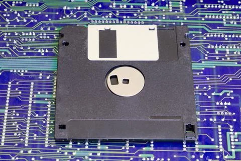 Floppy disk against electronic circuit board Stock Photos