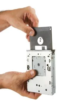 Floppy disk drive in hand Stock-Fotos