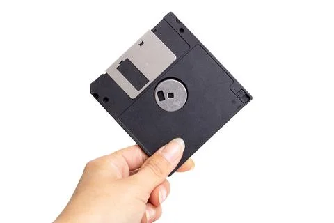 Floppy disk in hand isolated on white background Foto stock