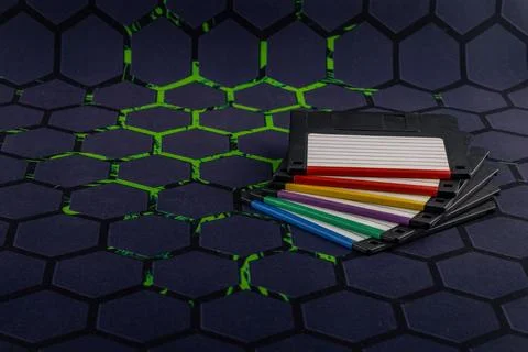 A floppy disk from an old computer placed on a black mouse pad Stockfoto's