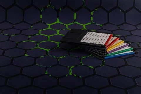 A floppy disk from an old computer placed on a black mouse pad Stockfoto's