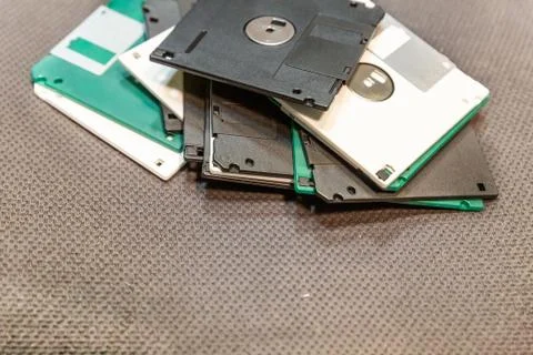 Floppy disk, old data recording tool, white and black multi-colored on a dark Foto stock