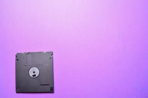 Floppy disk on a purple background Stockfoto's