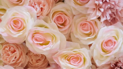 Floral background texture. Artificial flowers in pastel colors on the wall. Stock Footage 233198354