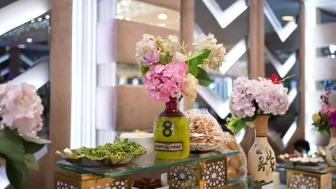 Floral Centerpieces on Buffet Table Stock Footage 341548941