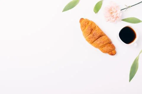Floral flat lay frame simple breakfast of croissant Stock Photos