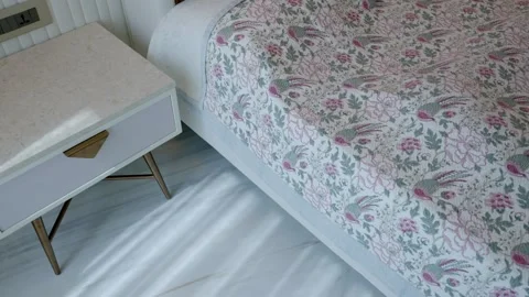 Floral Hand Block Bedsheet On Bed With Bedside Table. Bedroom Interior. Stock Footage 250162012