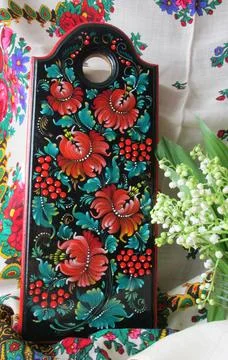 Floral pattern. Decorative board with red flowers and leaves, handmade by a f Stock Photos