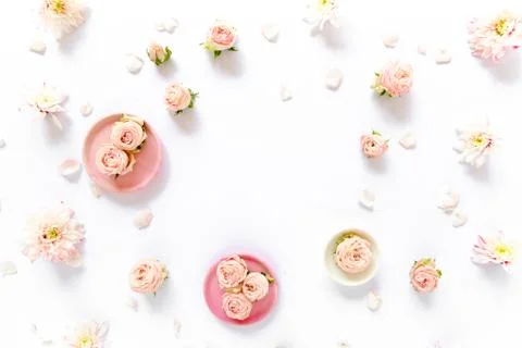 Floral pattern made of pink roses, green leaves, branches on white background Foto stock
