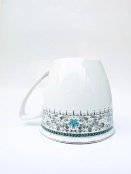 A  floral pattern tea cup isolated on white background Stock Photos