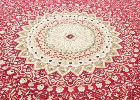Floral pattern on the wool carpet. Stock Photos