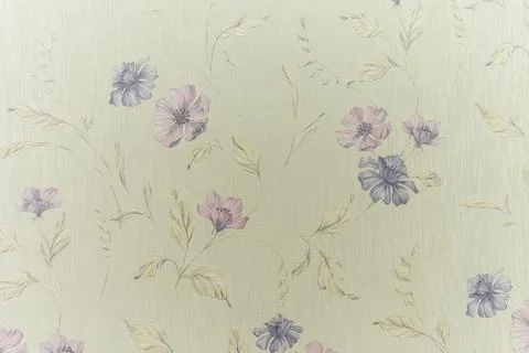 A floral patterned wall with a light green background Stock Photos