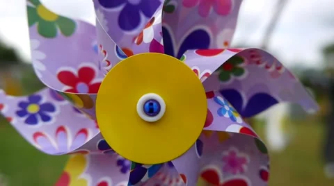 Floral patterns printed on children windmill, windmill turns fast Vídeo Stock 52695636
