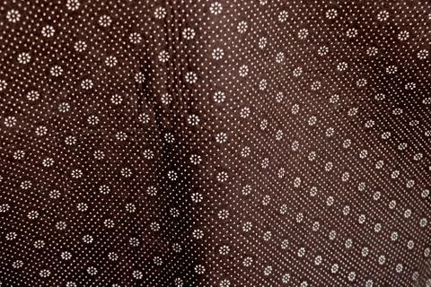 Floral round fabric pattern with dots brown color Stock Photos