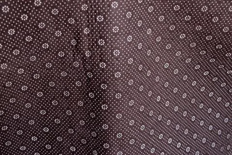Floral round fabric pattern with dots brown color 스톡 사진