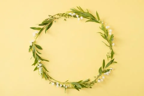 Floral round frame with copy space on a yellow background. Summer or spring.. Stock Photos