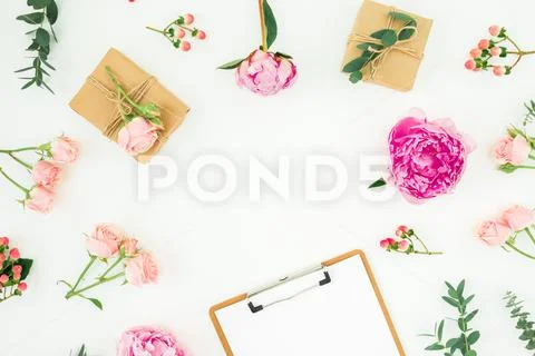 Floral round frame of pink peonies, roses, hypericum and eucalyptus branches Stock Photos