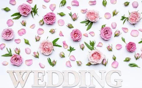 Floral wedding pattern on a white background. Petals, flowers and buds of ros Stock Photos