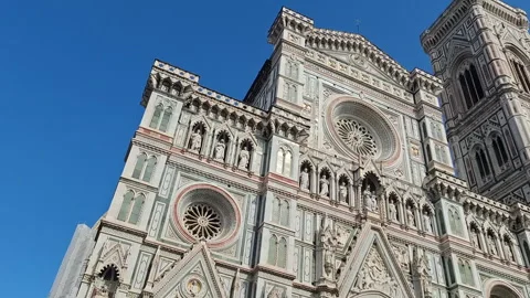 The Florence Cathedral facade and Giotto's Bell Tower against blue sky Stock Footage 344669954