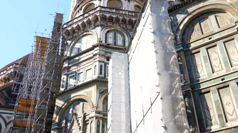 Florence Cathedral facade with marble details and scaffolding, Florence Italy 스톡 동영상 314982007