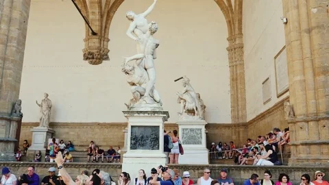 Florence, Italy, June, 2017: A group of tourists rests around: Statue in Uffizi Stock Footage