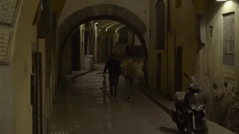 Florence Night Streets View Person with a Bike 4K Stock Footage 76672575