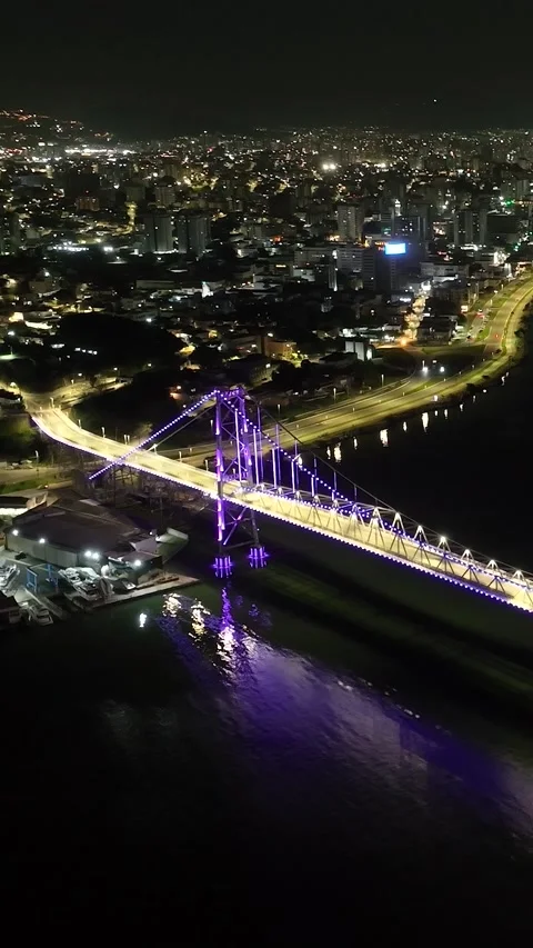Florianópolis at Night, Hercílio Luz Bridge Illuminated in Purple Lights Over 스톡 동영상 344998727