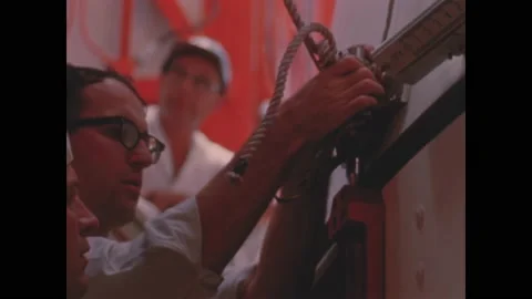 FLORIDA - 1966 - NASA engineers complete assembling the AS-202 and its launch Stock Footage 330602531