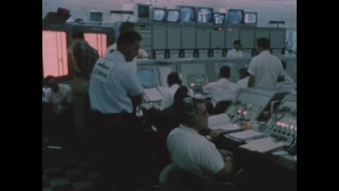 FLORIDA - 1966 - NASA flight technicians work in a control room ahead of the Video stock 327740380