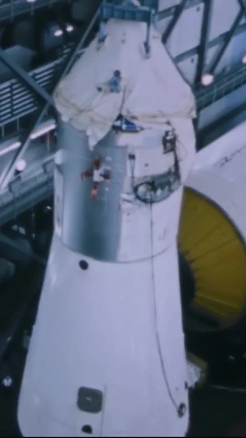 FLORIDA - 1967 - A command service module is hoisted upwards within the KSC's Stock Footage 342654877