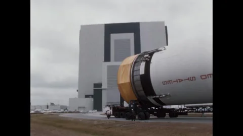 FLORIDA - 1967 - The prime mover pulls the S-II stage into the VAB or Vehicle Stock Footage 340589419