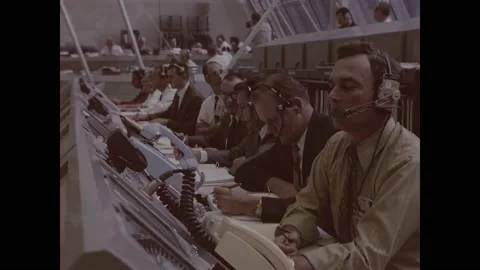 FLORIDA - 1970 - Men staff computers at NASA's control room during the Apollo 13 Stock Footage 304157990
