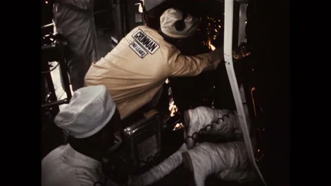 FLORIDA - 1970 - NASA technicians help the Apollo 13 astronauts get into their Stock Footage 322971055
