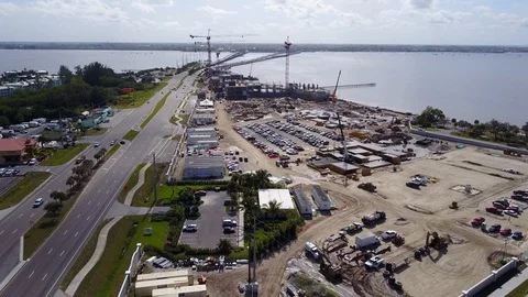 Florida Crane Construction aerial 7 development river Stock Footage 124696981