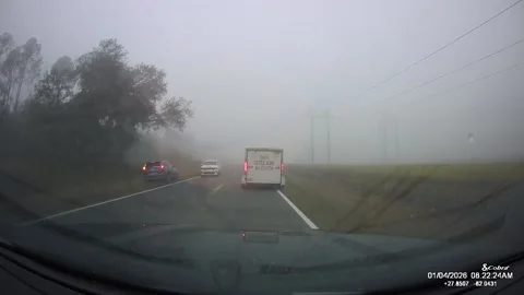Florida Driver Attempts Dangerous Pass in Heavy Fog, Polk County, Florida, USA - Stock Footage 325913860
